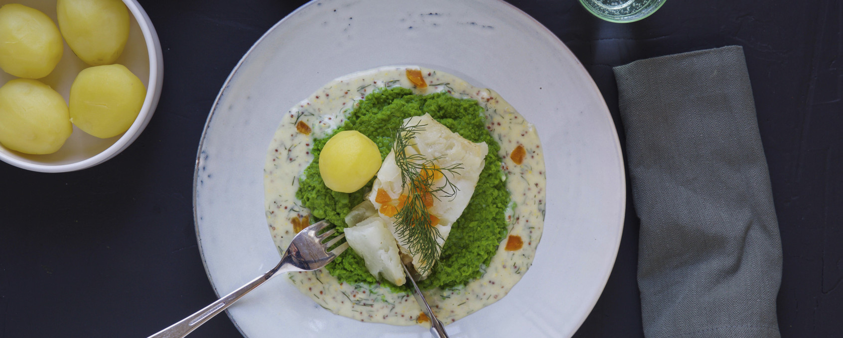 Lutefisk med sennepssaus og ertepuré