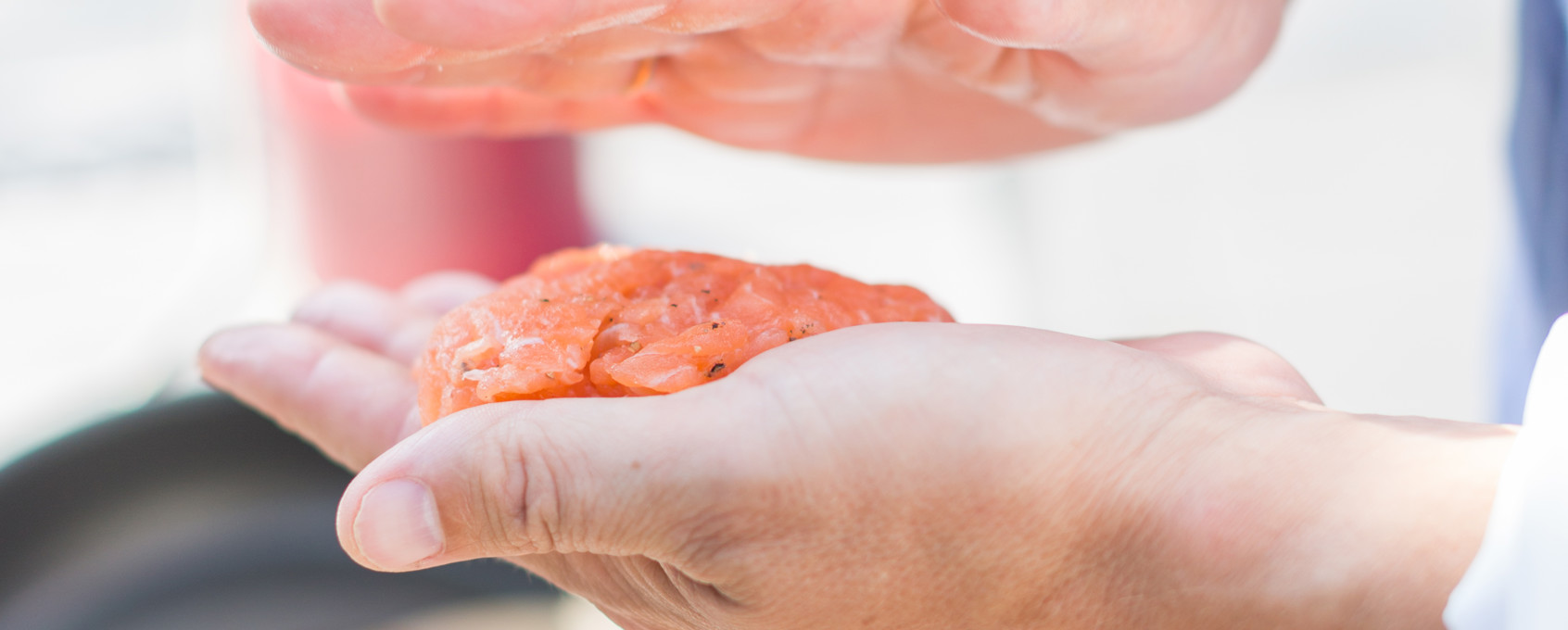 Chef with salmon burger